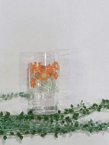 a bunch of orange flowers small glass