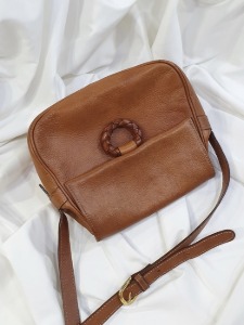 woven buckle natural leather bag